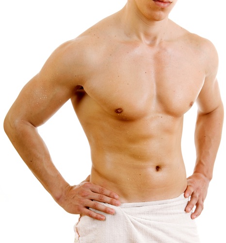 White male without shirt with white towel around waist